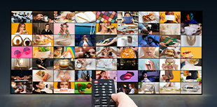 hand-holding-tv-remote-front-large-screen